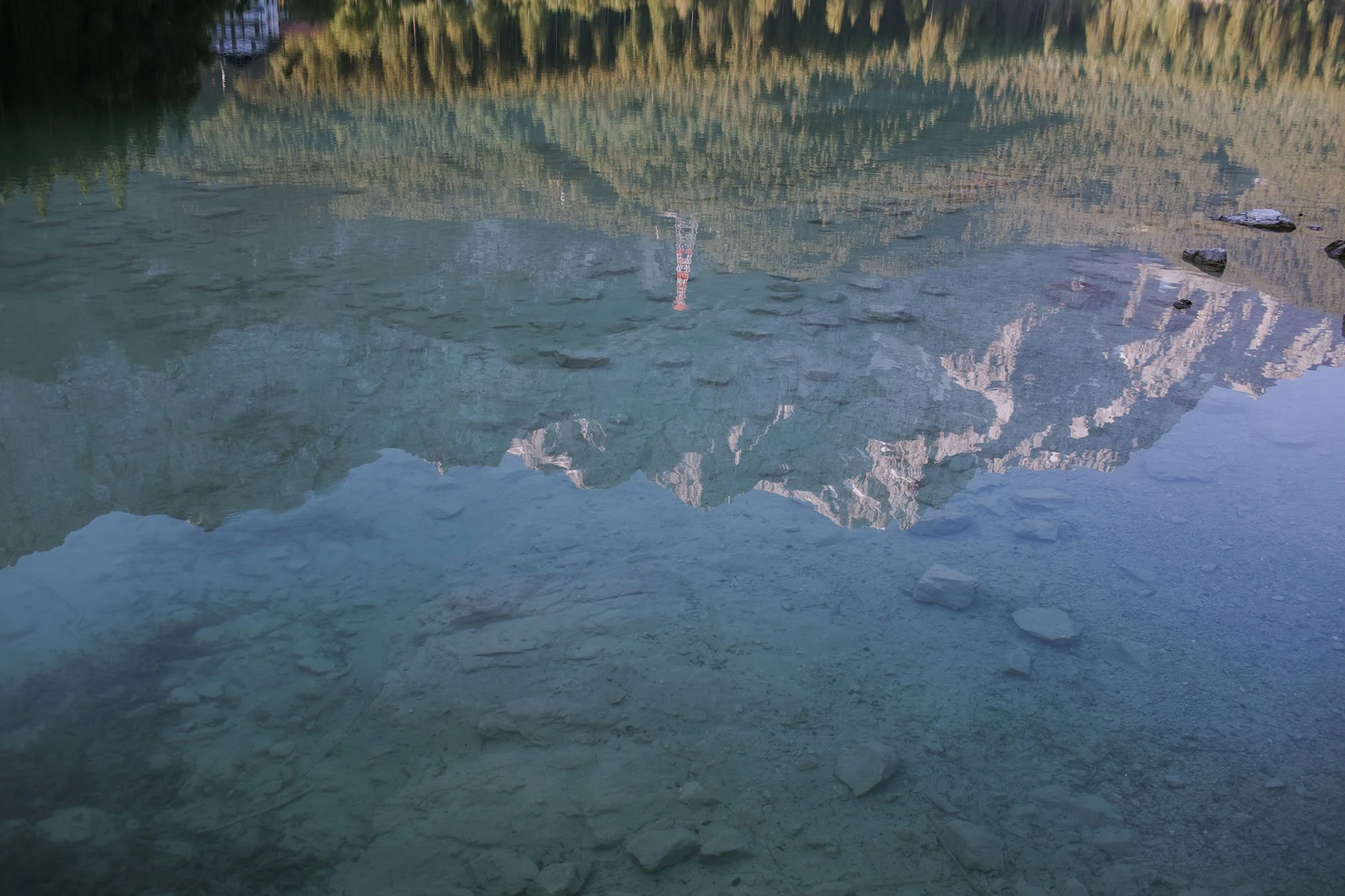 Clear lake water mirroring the alpine mountains at Eibsee Germany