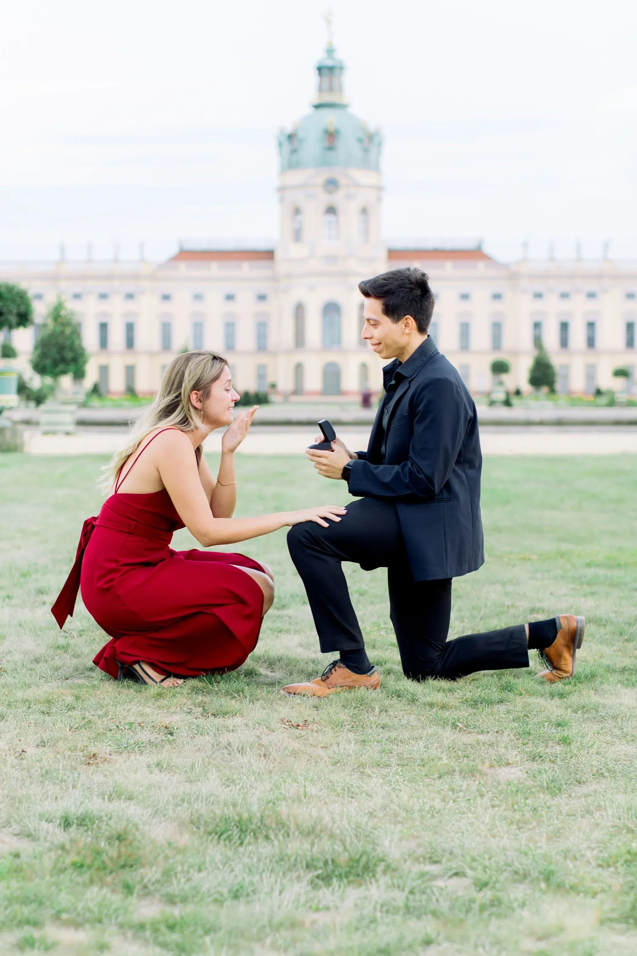 A marriage proposal in front of Charlottenburg Palace in Berin.
