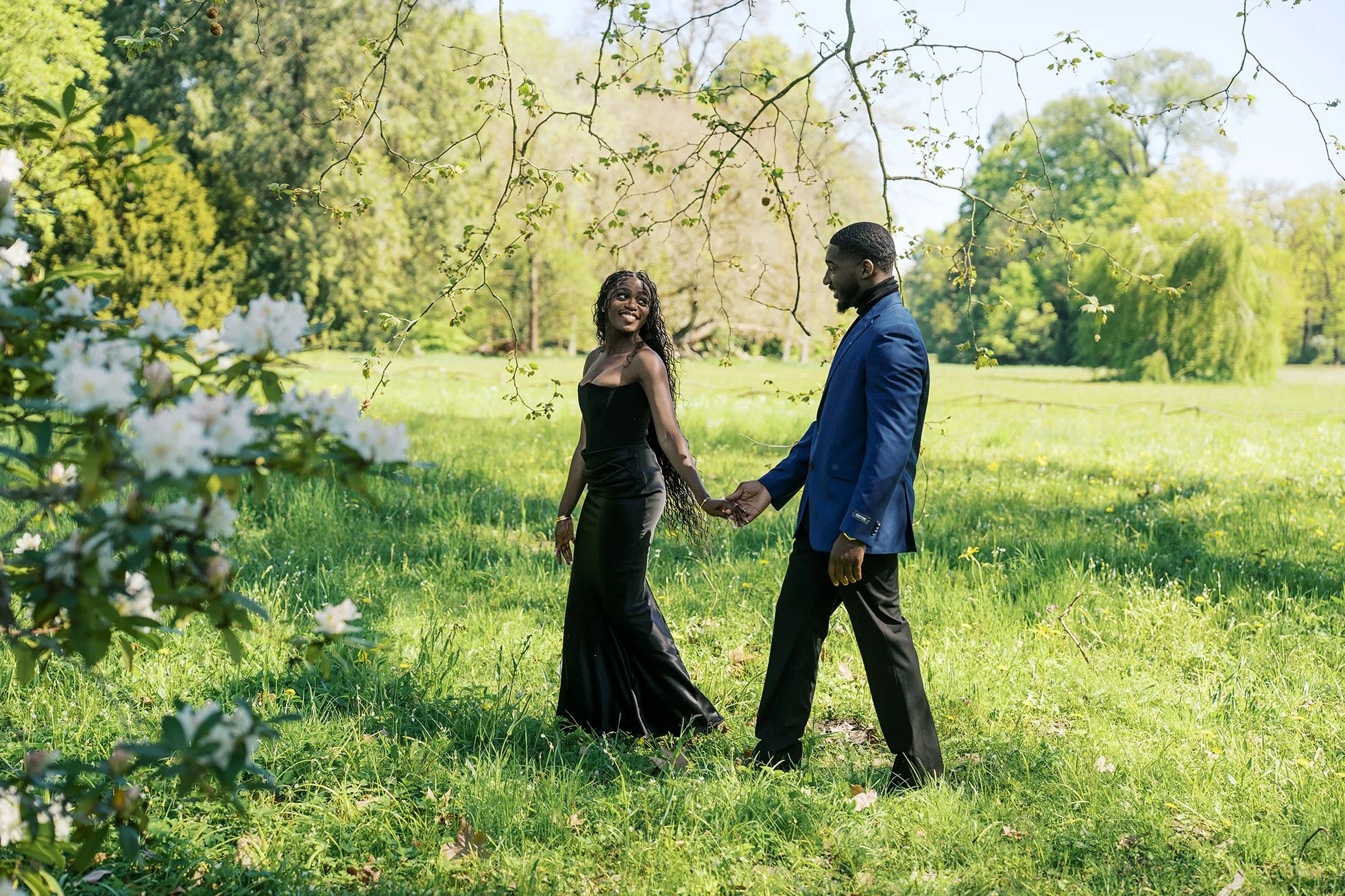 Romantic couple portraits in a park on Berlin Peacock island in summer.