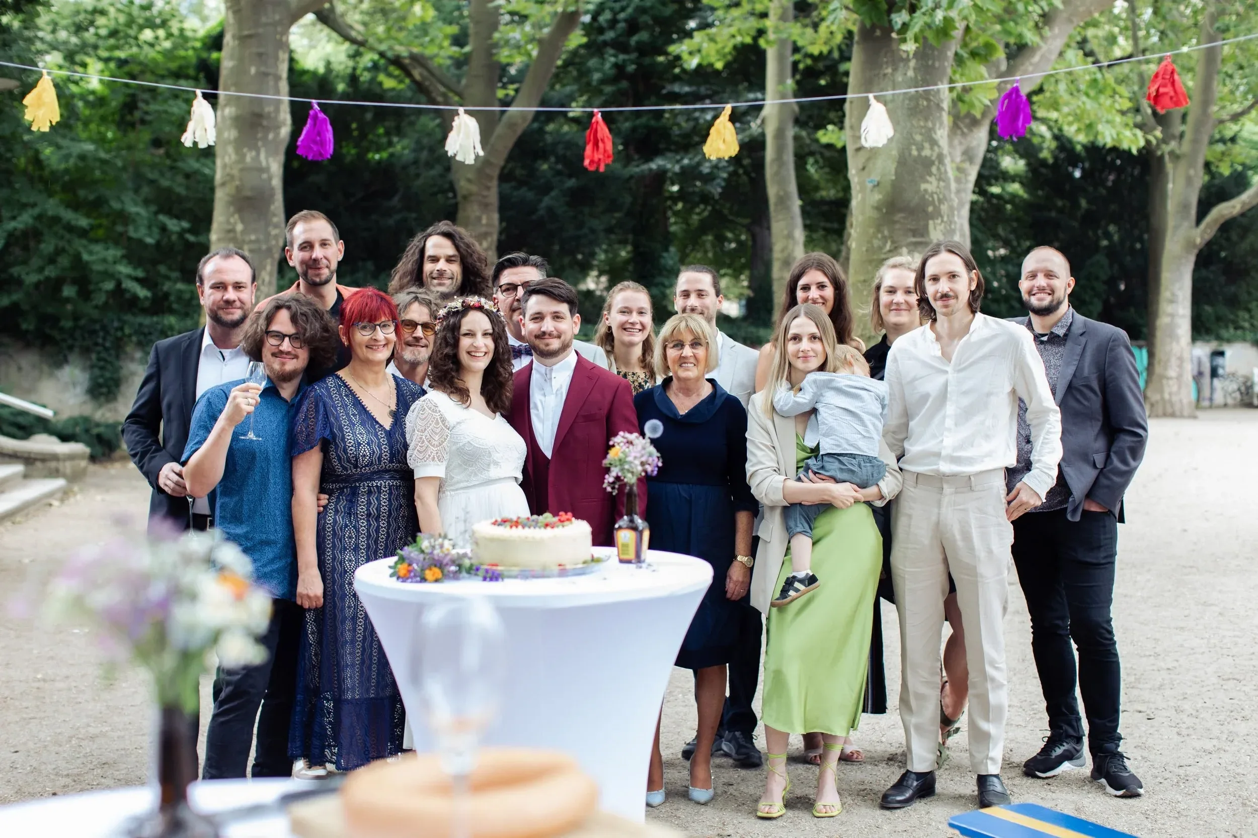 wedding guests smiling at one of the beautiful parks in schöneberg​