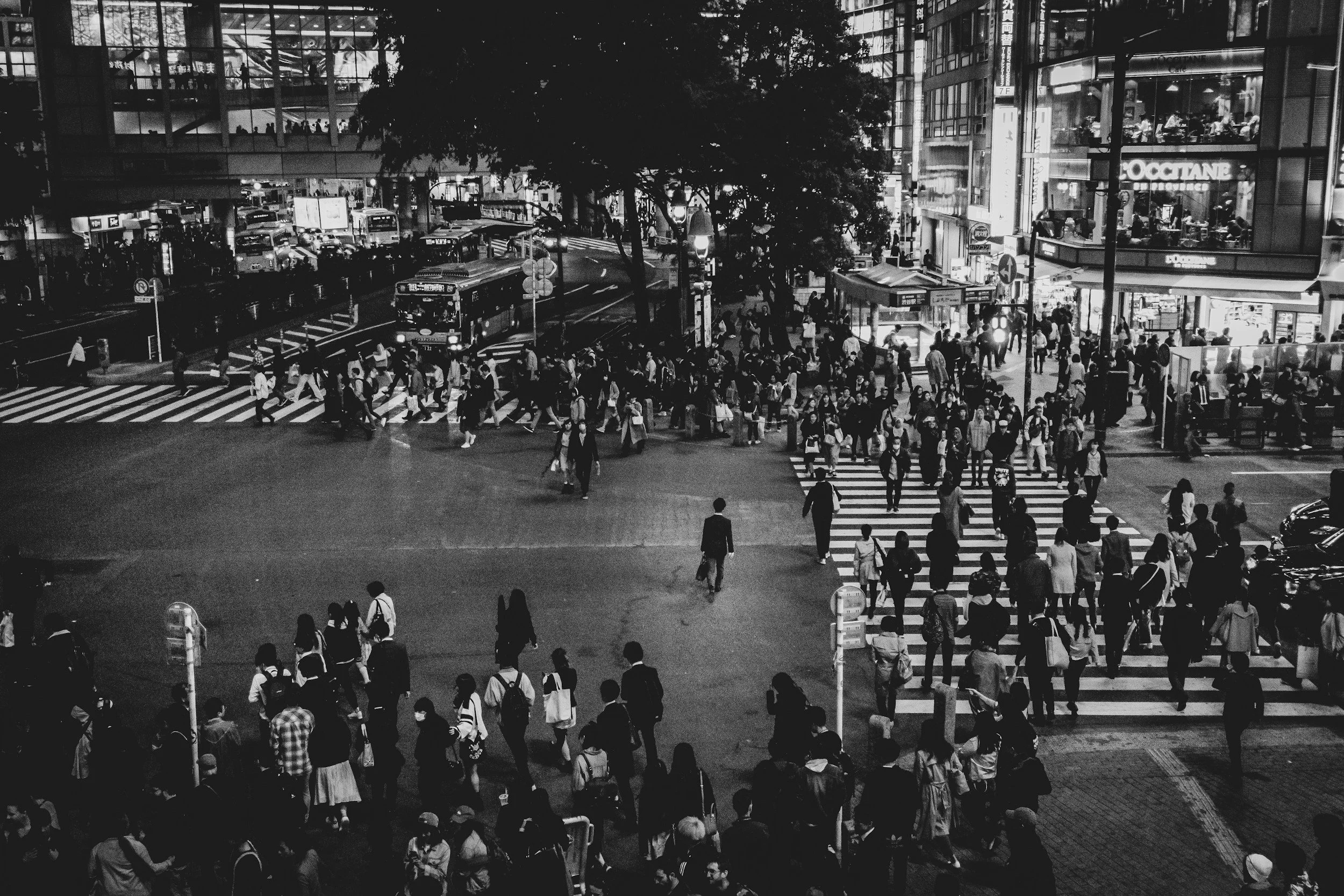 High-angle view of a busy Tokyo intersection, representing the overwhelming scale of the Japanese market and the necessity of a curated network to navigate the noise.
