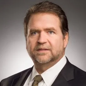 ortrait of Robert A. Madsen, Senior Fellow at MIT and advisor to The Delphi Network, specializing in Japanese macroeconomics and geopolitical strategy.