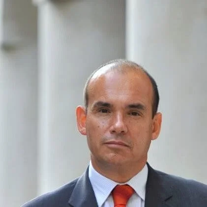 Portrait of Michael Woodford, former CEO of Olympus and advisor to The Delphi Network, recognized globally for exposing the Olympus accounting fraud and championing corporate governance.