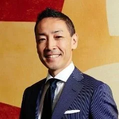 Portrait of Dr. Yoshi Fujikawa, faculty member at Hitotsubashi ICS and advisor to The Delphi Network, specializing in global service innovation and marketing strategy.