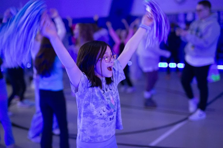 A student dancing at a school event