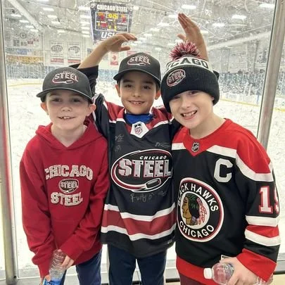 Three students at a Chicago Steel hockey night