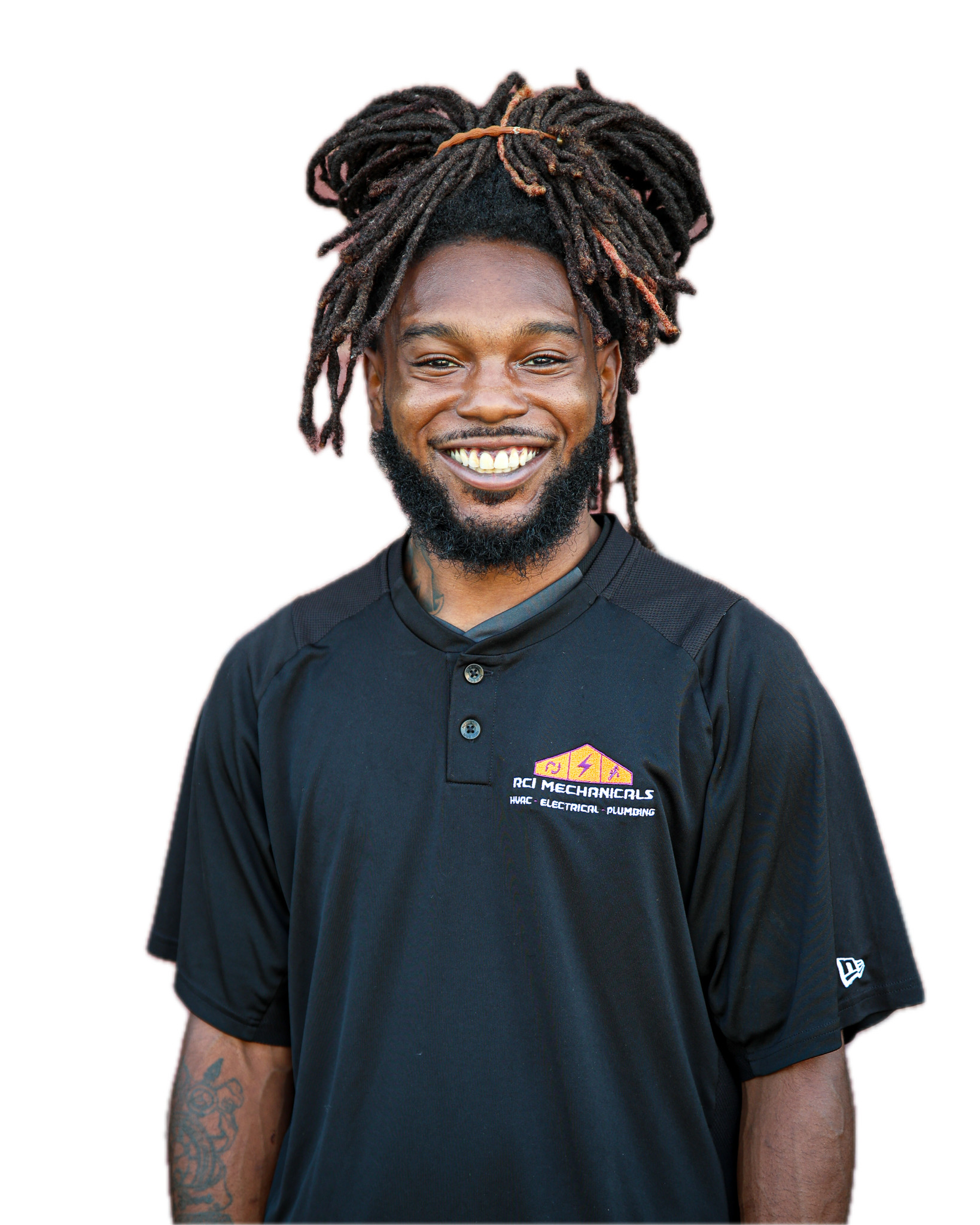 A smiling man with dreadlocks, a beard, and tattoos on his arms, wearing a black t-shirt with an electrical repair company's logo.