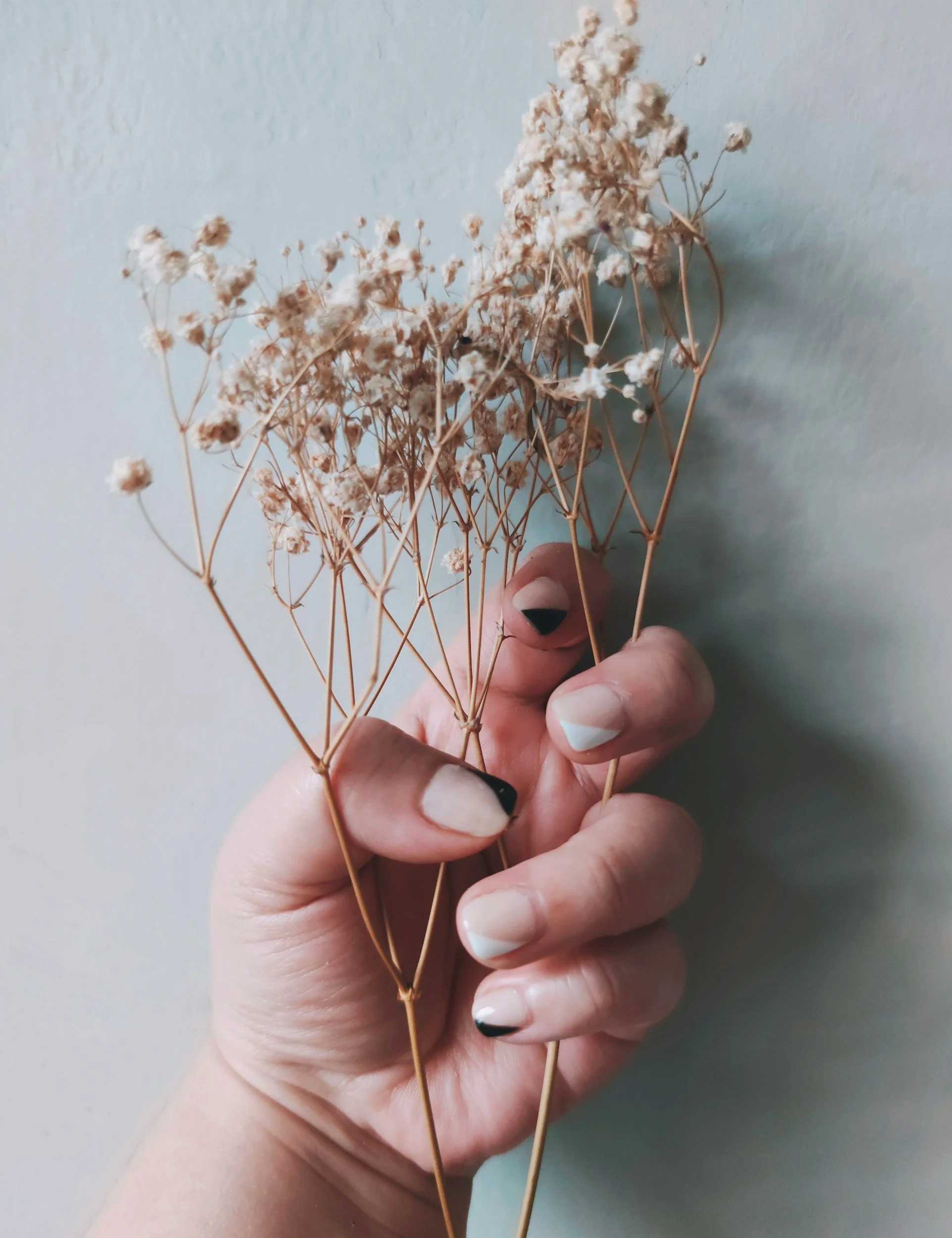 A woman holding flowers having seen an eating disorder therapist in Dallas