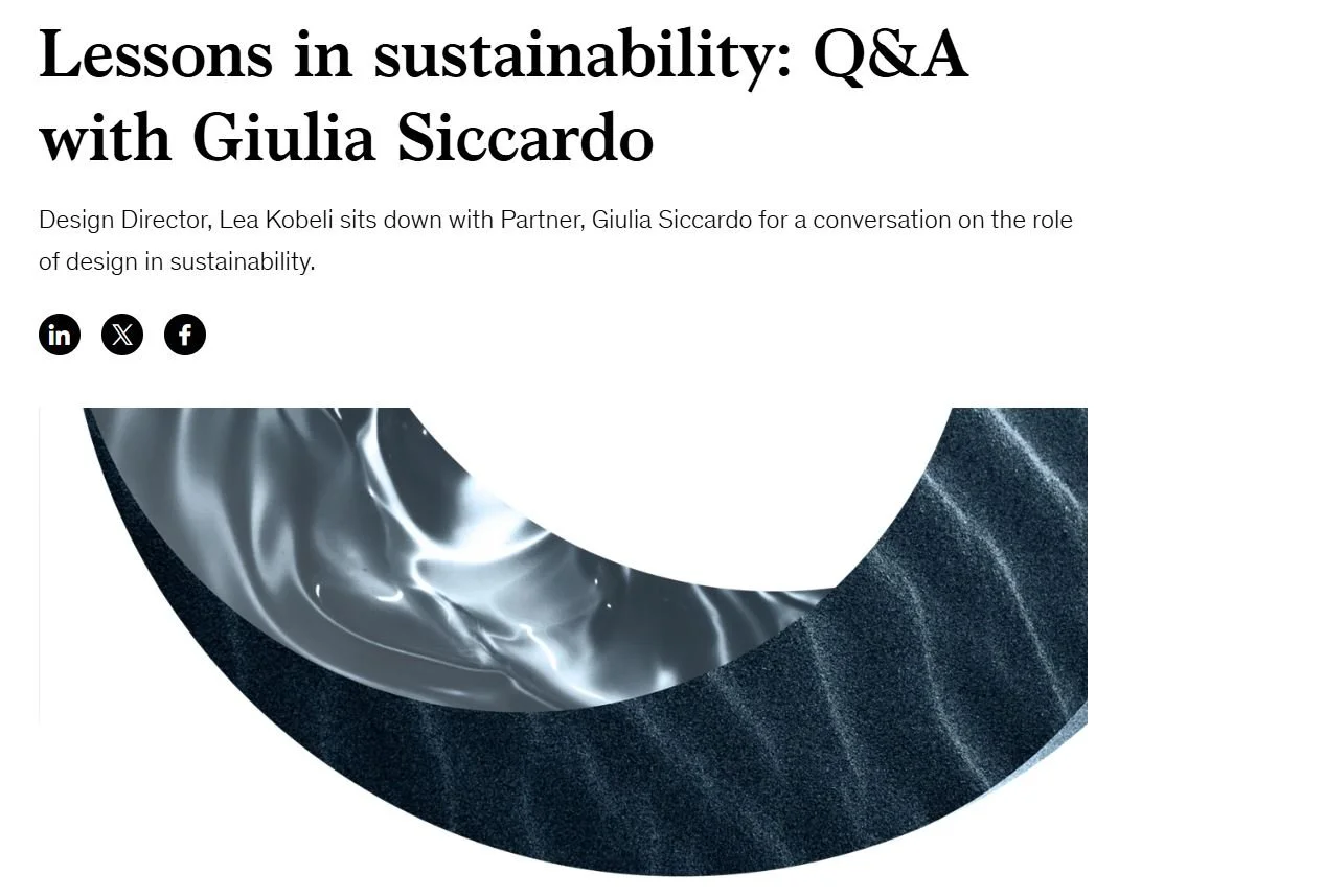 The website features an article titled 'Lessons in sustainability: Q&A with Giulia Siccardo'. The subtitle explains that Design Director Lea Kobeli is in conversation with Giulia Siccardo about design's role in sustainability. There are social media icons for LinkedIn, X, and Facebook. An abstract, circular graphic with metallic and textured surfaces is partially visible beneath the text.