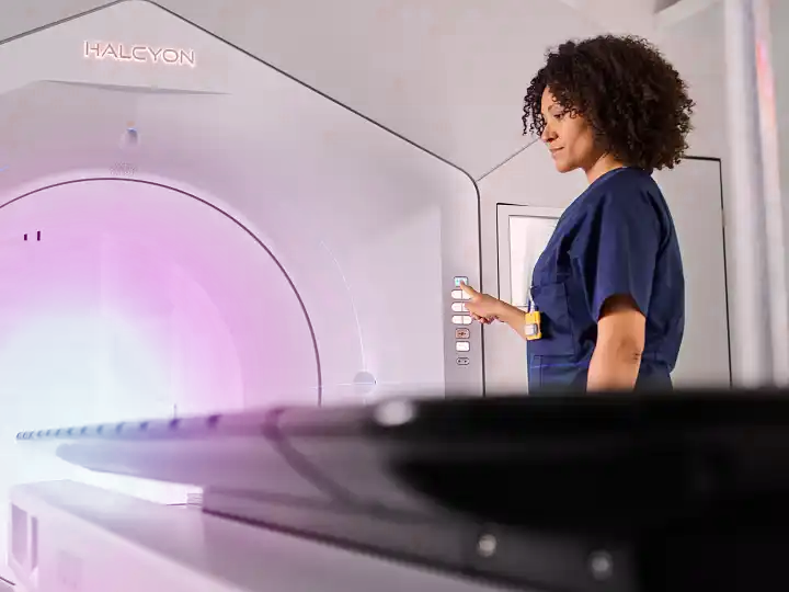 Radiotherapy nurse / treater operating the Varian Halcyon radiotherpy system