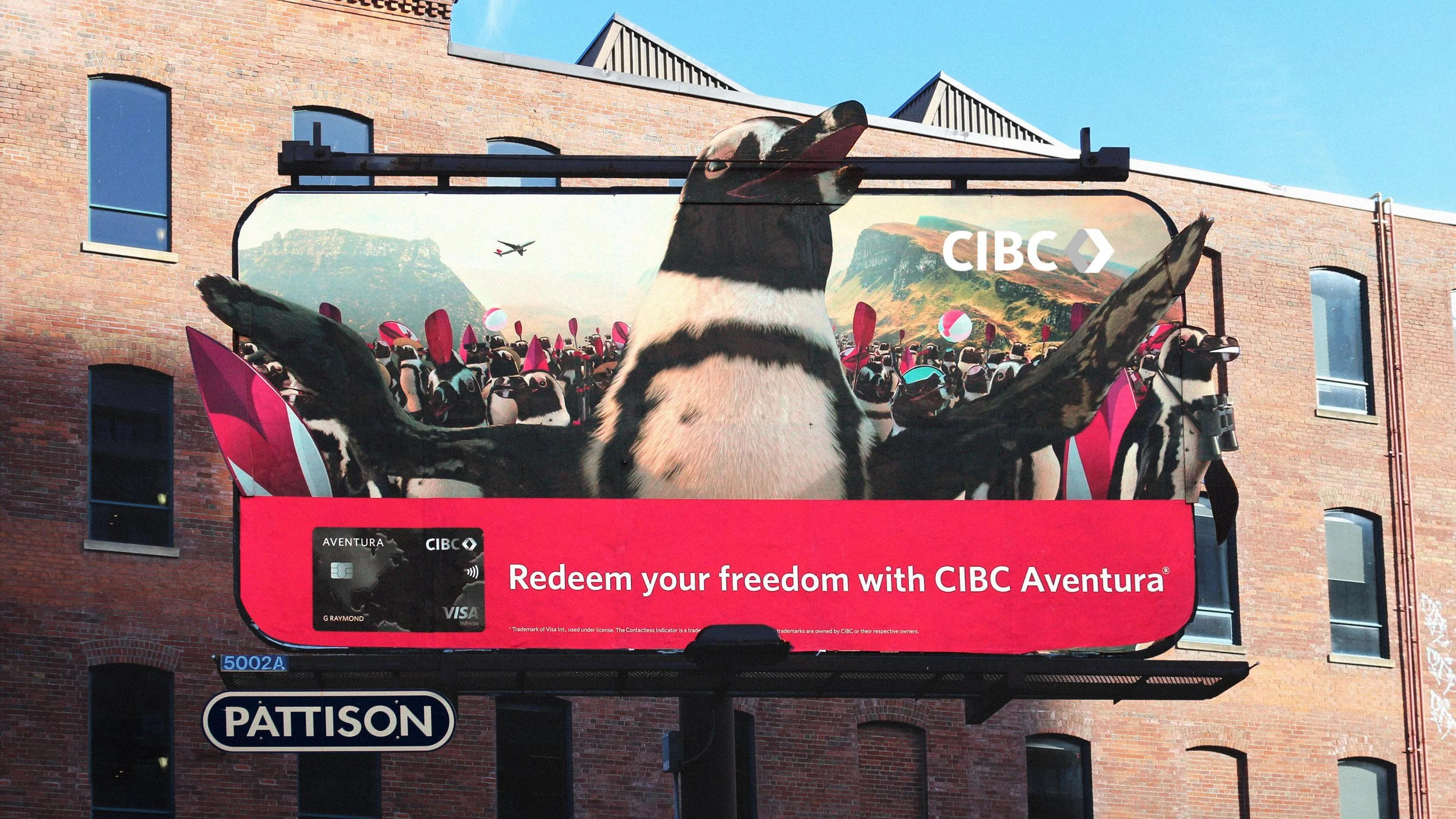 A billboard showing an army of penguins.