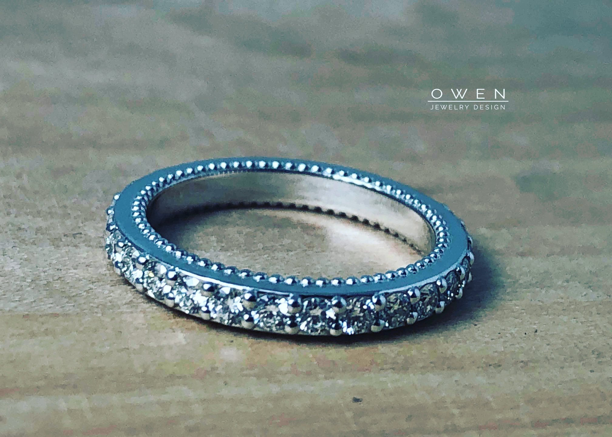 CUSTOM WHITE GOLD ETERNITY WEDDING BAND WITH ROUND BRILLIANT CUT DIAMONDS.jpg