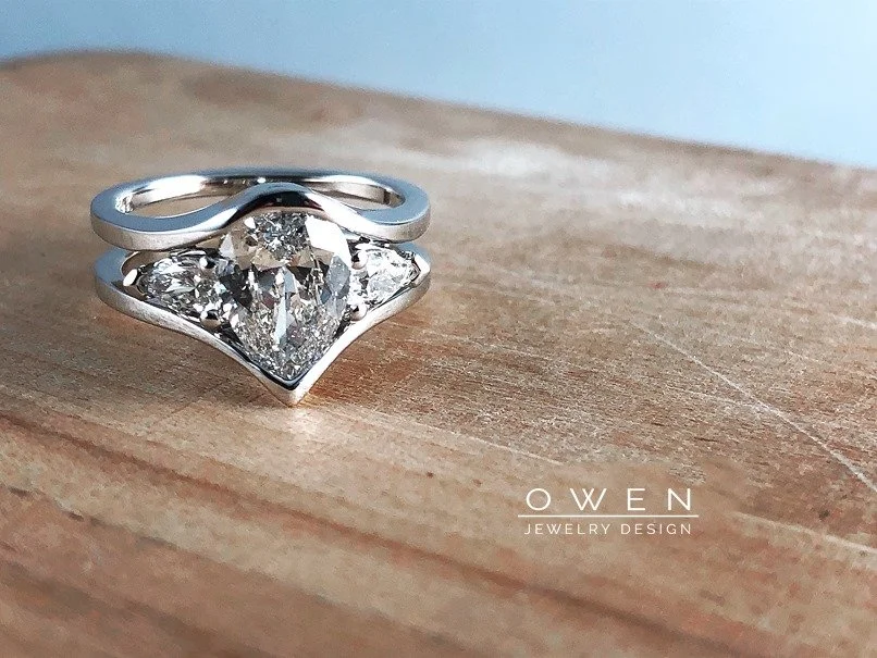 WHITE GOLD RING WITH PEAR SHAPED DIAMONDS