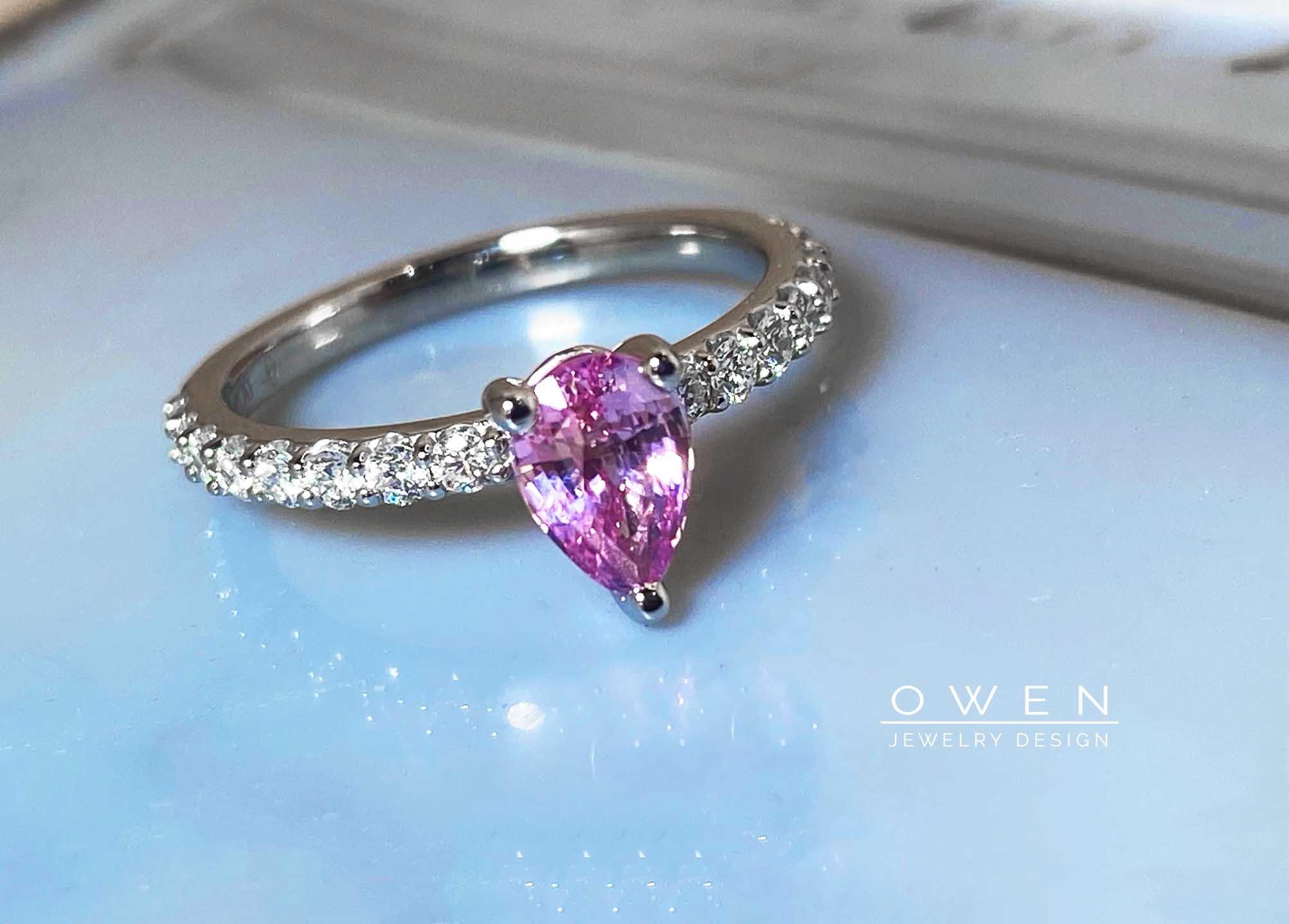 CUSTOM PLATINUM RING CONTAINING A BRILLIANT CUT PINK SAPPHIRE AND ROUND BRILLIANT CUT DIAMONDS.jpg