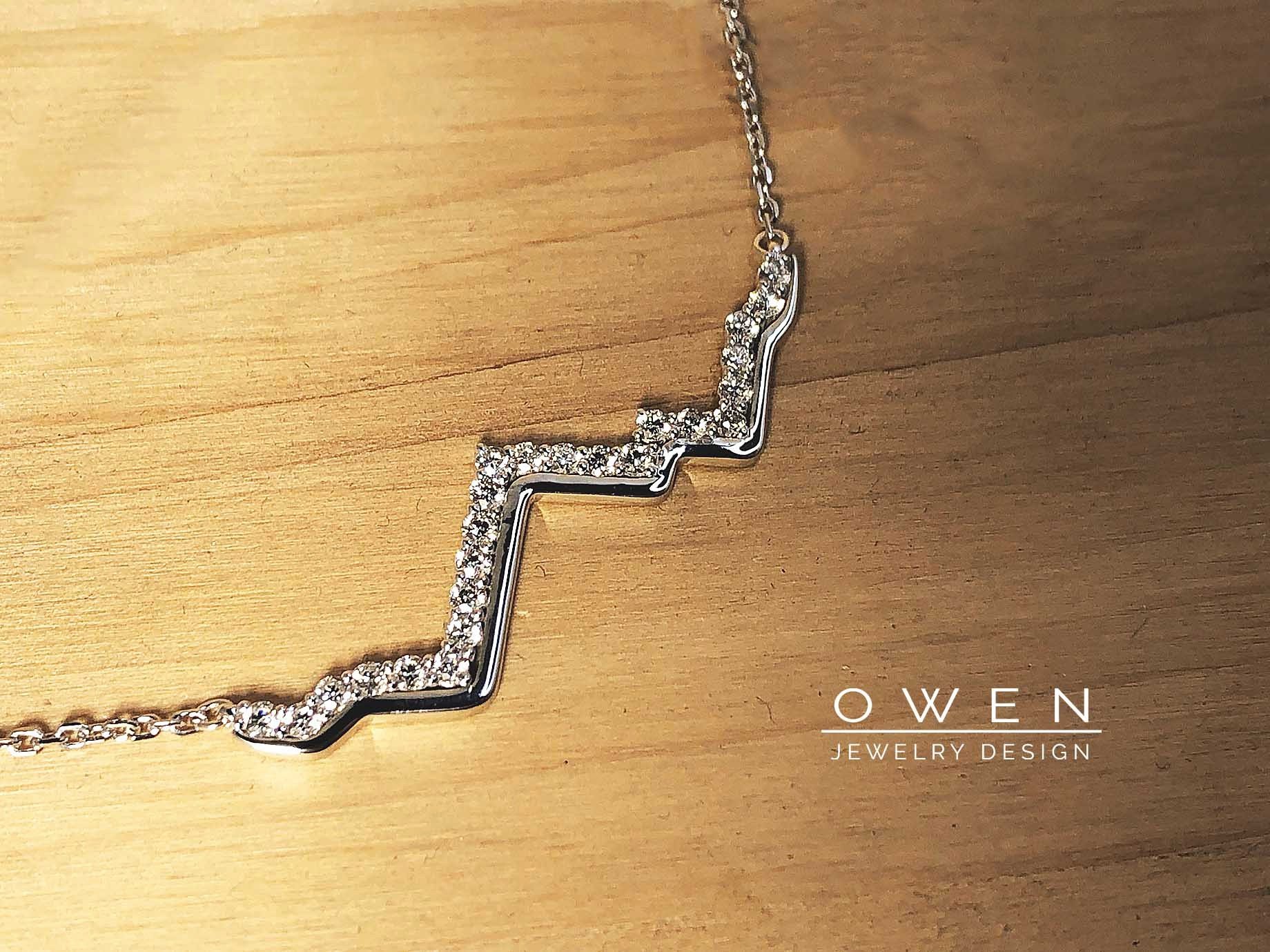 CUSTOM WHITE GOLD MOUNTAIN RANGE PENDANT WITH ROUND BRILLIANT CUT DIAMONDS.jpg