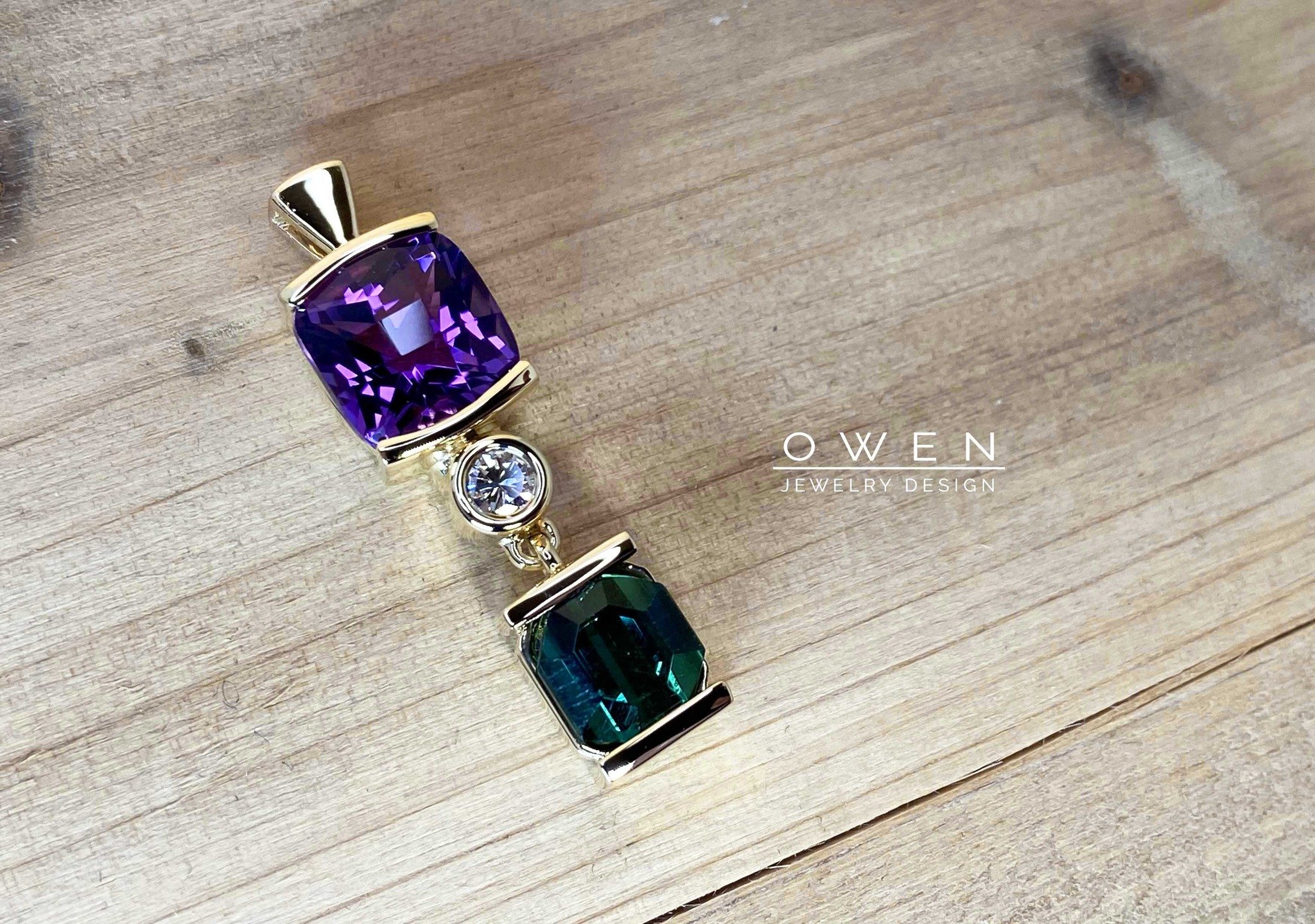 CUSTOM YELLOW GOLD PENDANT CONTAINING AN AMETHYST, DIAMOND, AND GREEN TOURMALINE.jpg
