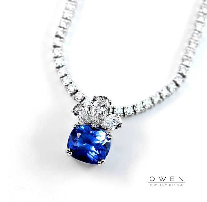 CUSTOM WHITE GOLD PENDANT WITH A SAPPHIRE AND PEAR SHAPED DIAMONDS.jpg