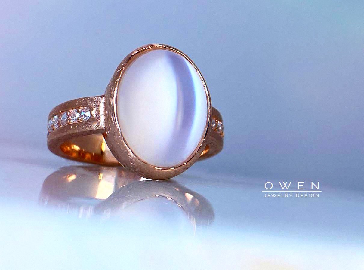 CUSTOM 14K ROSE GOLD RING WITH AN OVAL SHAPED MOONSTONE AND NATURAL ROSE CUT DIAMONDS.jpg