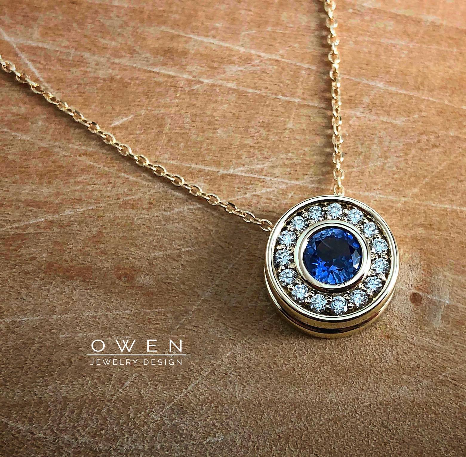 CUSTOM YELLOW GOLD PENDANT WITH A NATURAL CEYLON SAPPHIRE AND ROUND BRILLANT CUT DIAMONDS.jpg