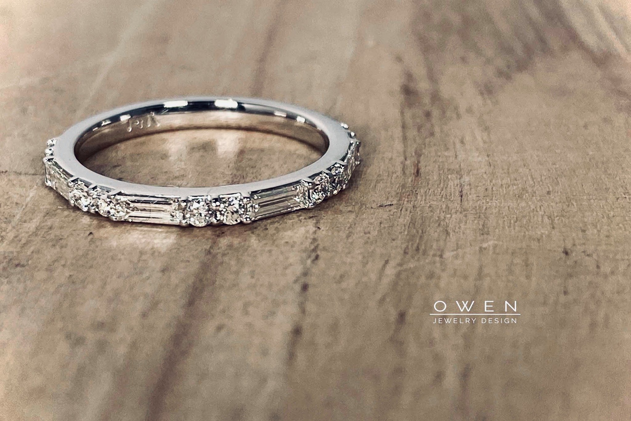 CUSTOM WHITE GOLD WEDDING BAND WITH ROUND BRILLANT AND BAGUETTE DIAMONDS.jpg