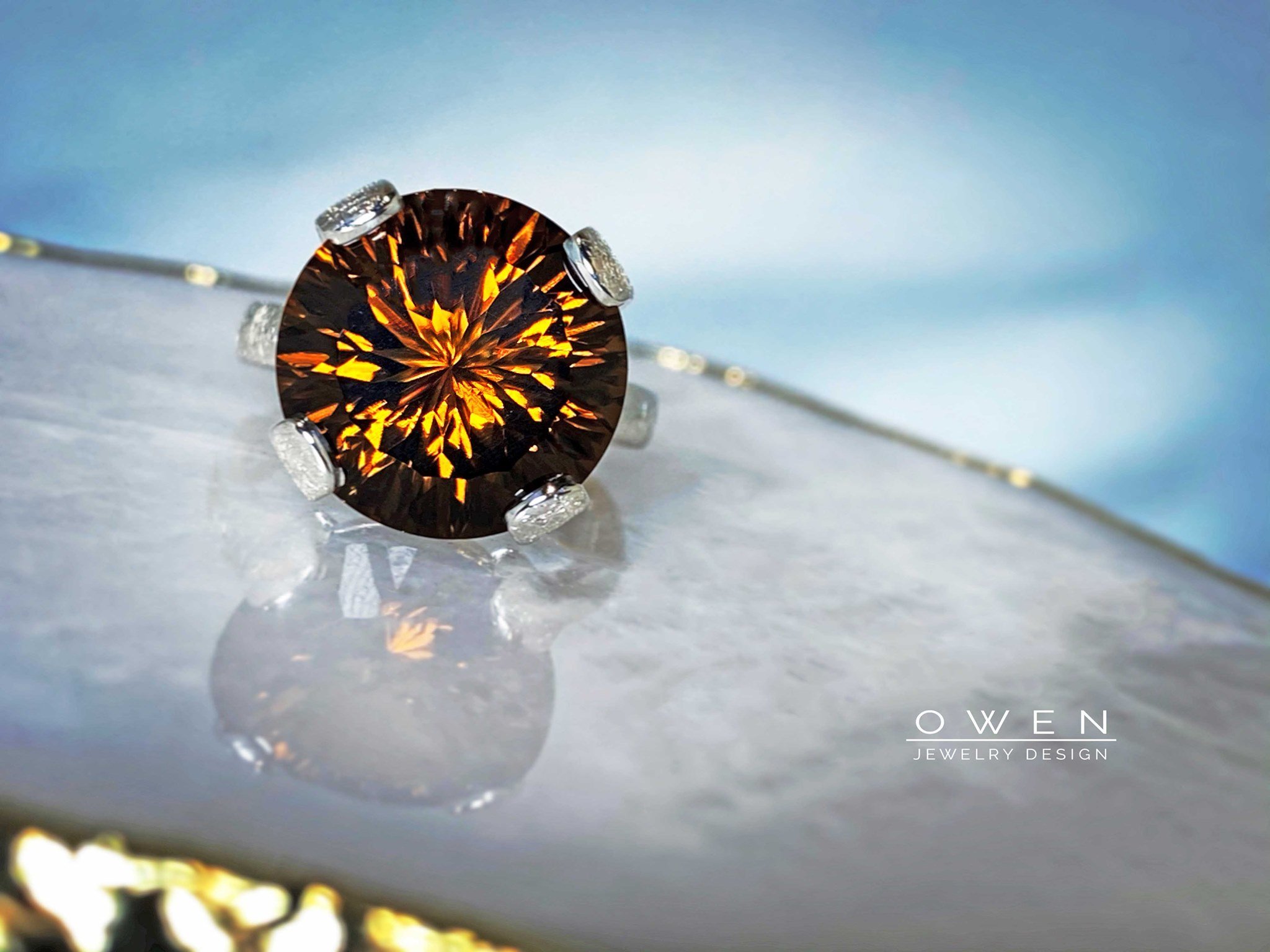 CUSTOM STERLING SILVER RING WITH A ROUND FANCY CUT SMOKEY QUARTZ.jpg