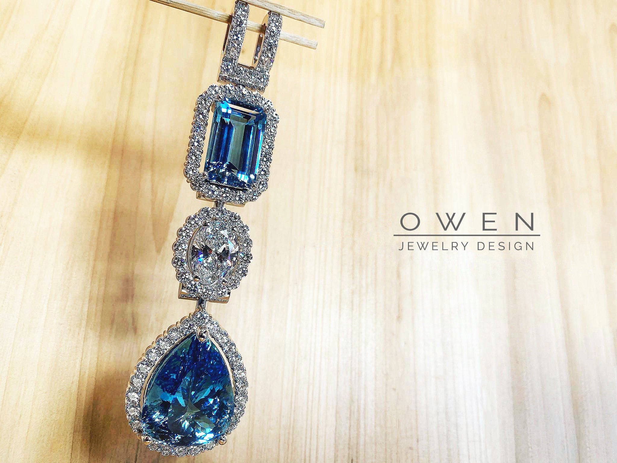 CUSTOM WHITE GOLD PENDANT CONTAINING TWO BRAZILIAN AQUAMARINES AND ROUND CUT DIAMONDS.jpg