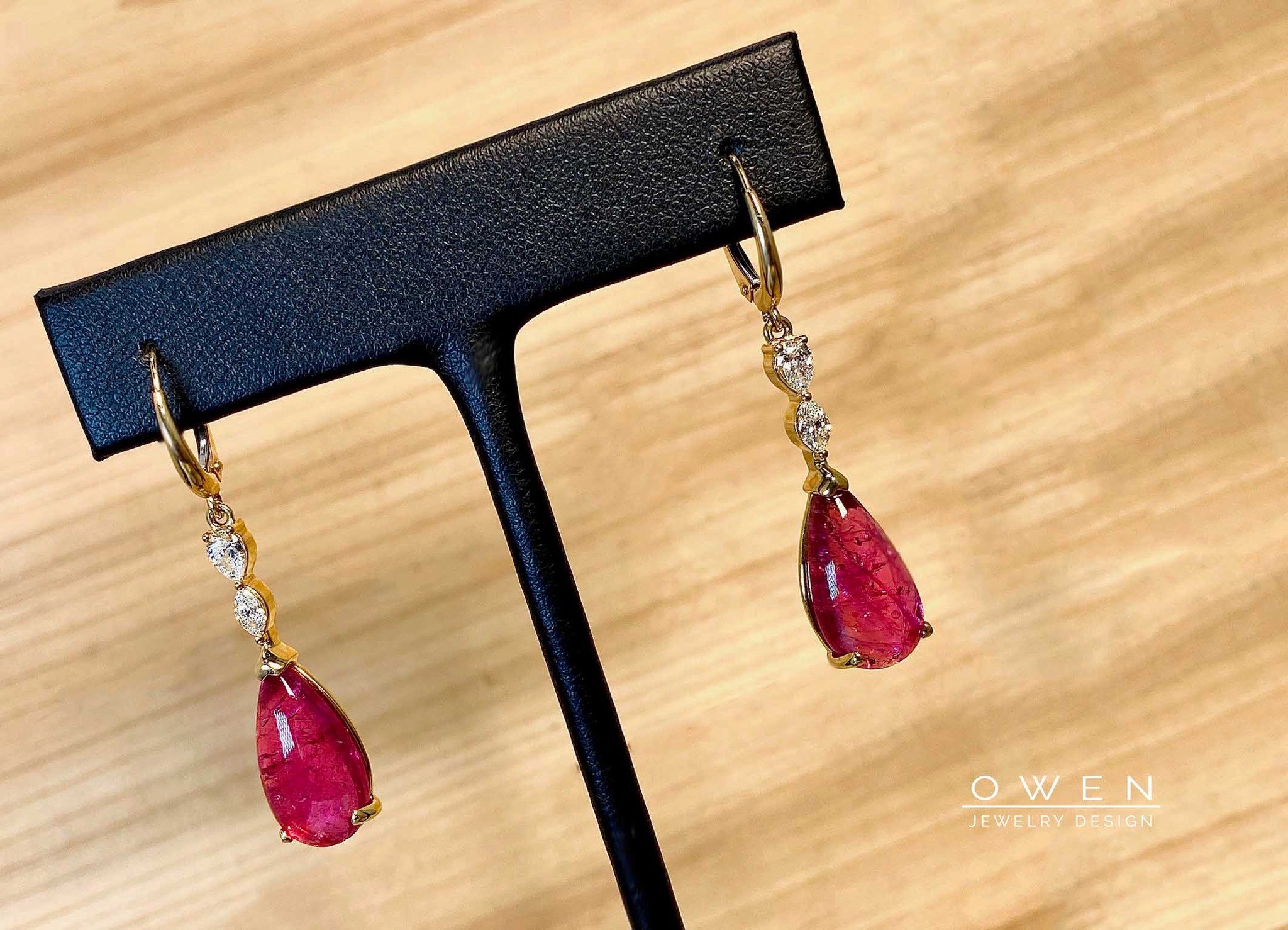 CUSTOM YELLOW GOLD EARINGS WITH PEAR SHAPED CABOCHON BRAZILIAN RUBELLITE, MARQUISE DIAMONDS, AND PEAR SHAPED DIAMONDS.jpg
