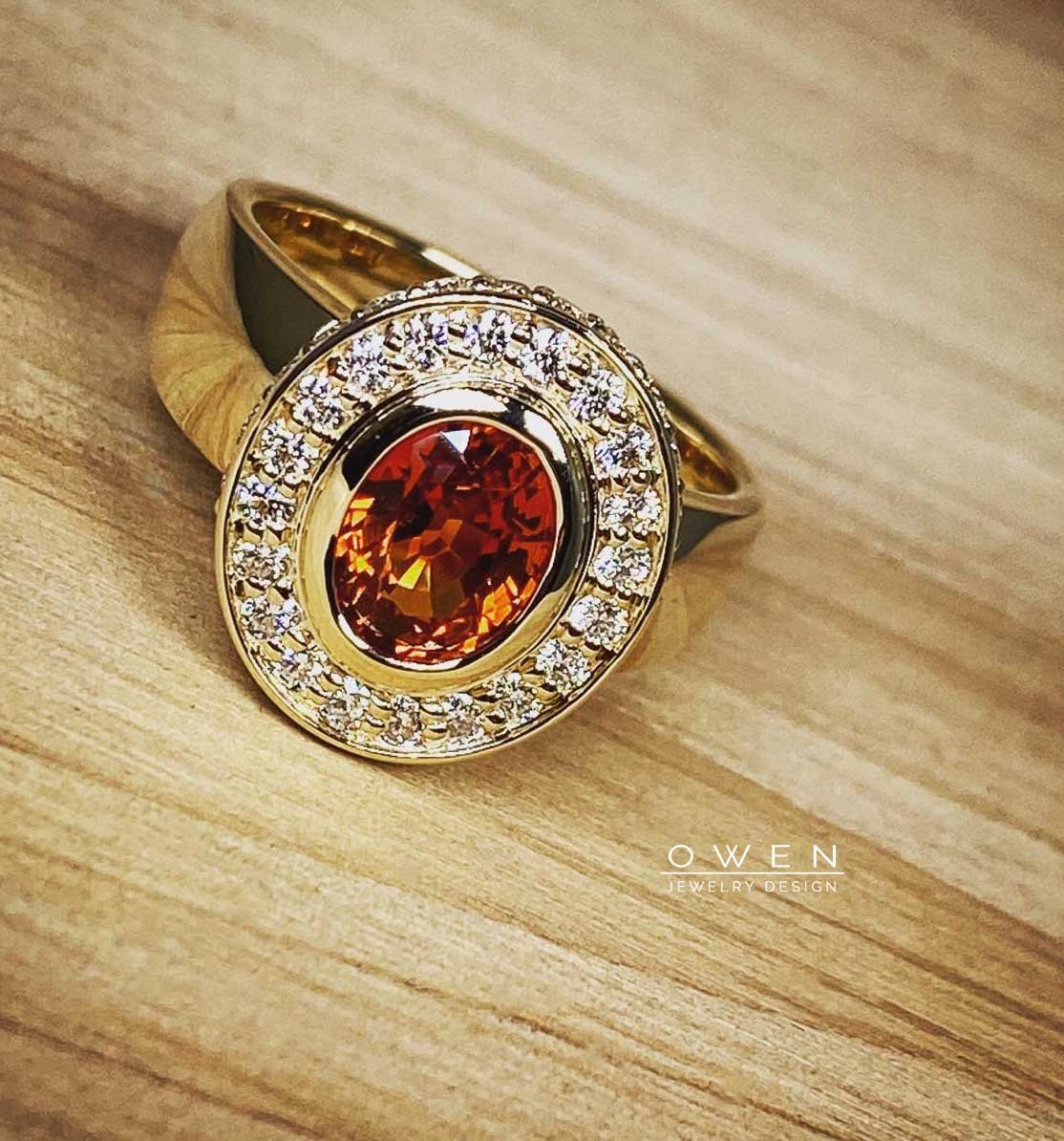 CUSTOM YELLOW GOLD RING WITH ORANGE SAPPHIRE AND ROUND BRILLIANT CUT DIAMONDS.jpg