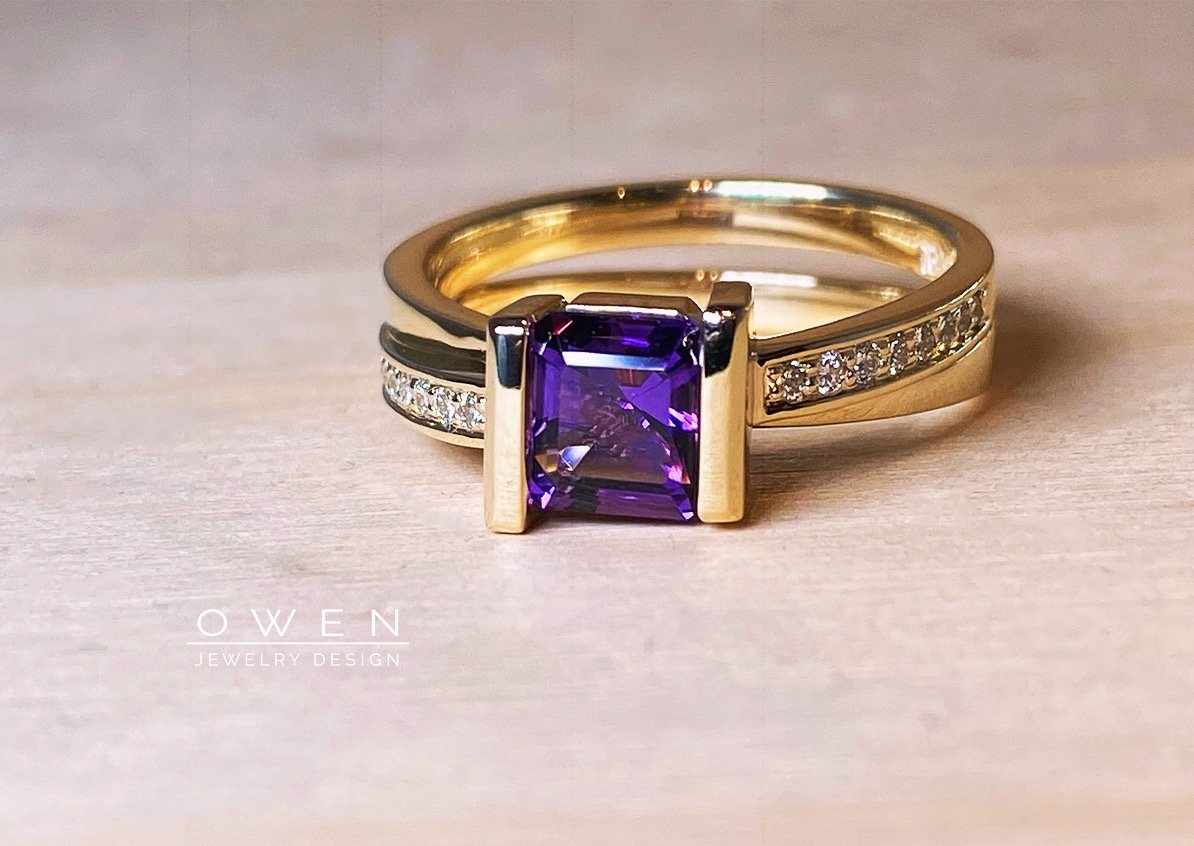 CUSTOM YELLOW GOLD RING WITH AN ASSCHER CUT AMETHYST AND ROUND DIAMONDS.jpg