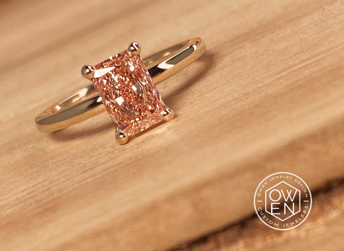 CUSTOM YELLOW GOLD RING WITH A RADIANT CUT PINK DIAMOND.jpg