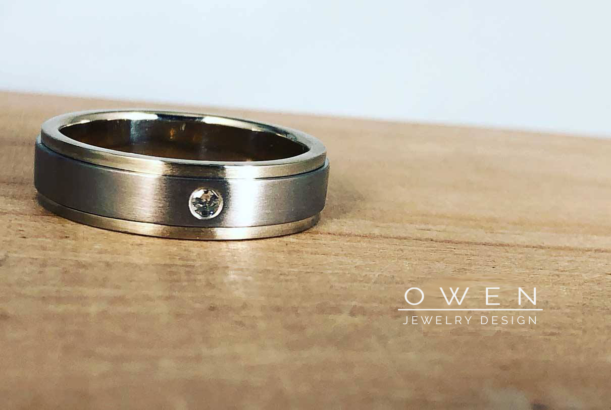 CUSTOM WHITE GOLD AND PALLADIUM WEDDING BAND WITH A DIAMOND.png