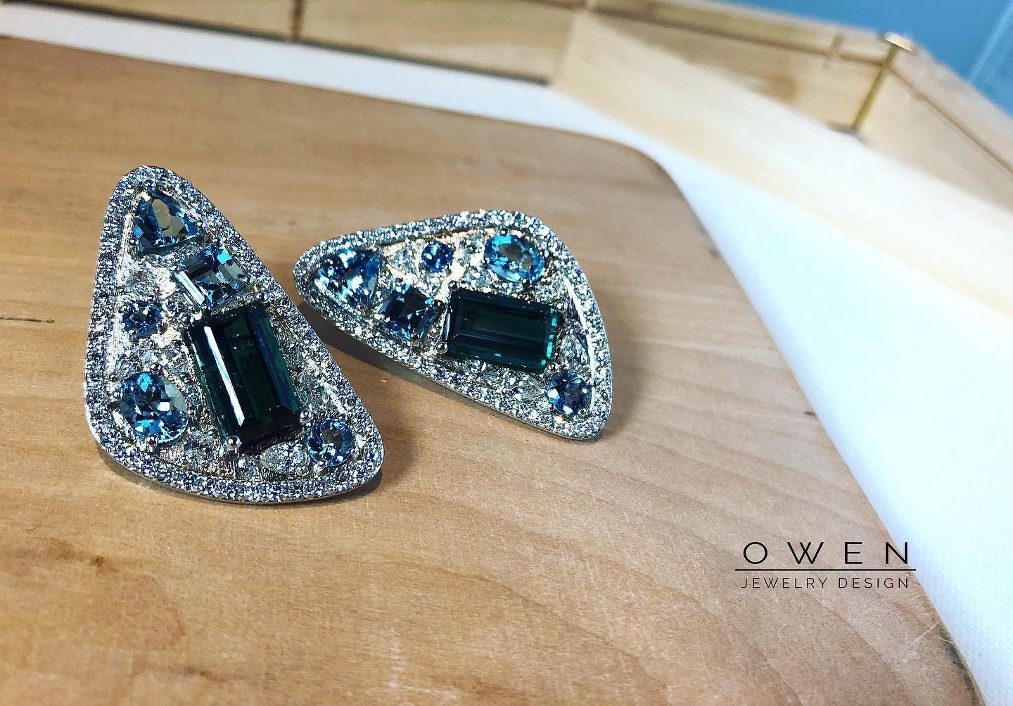 CUSTOM WHITE GOLD EARRINGS WITH A BRAZILIAN INDICOLITE, SANTA MARIA AQUAMARINE, AND ROUND DIAMONDS.jpg