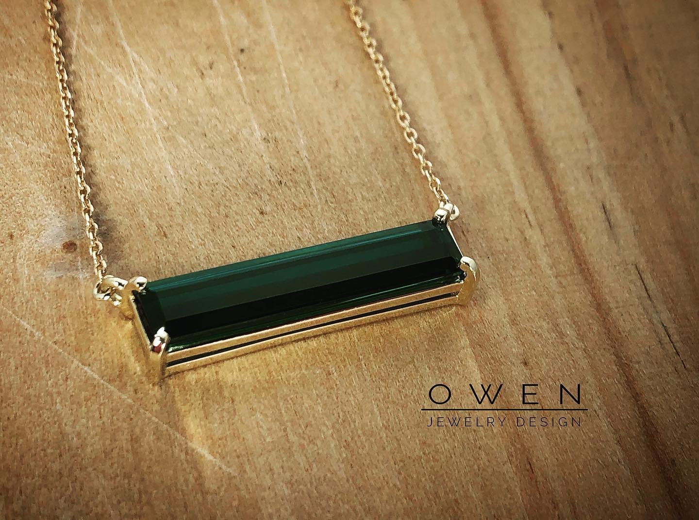 CUSTOM YELLOW GOLD NECKLACE WITH A RECTANGLE CUT BRAZILIAN GREEN TOURMALINE.jpg