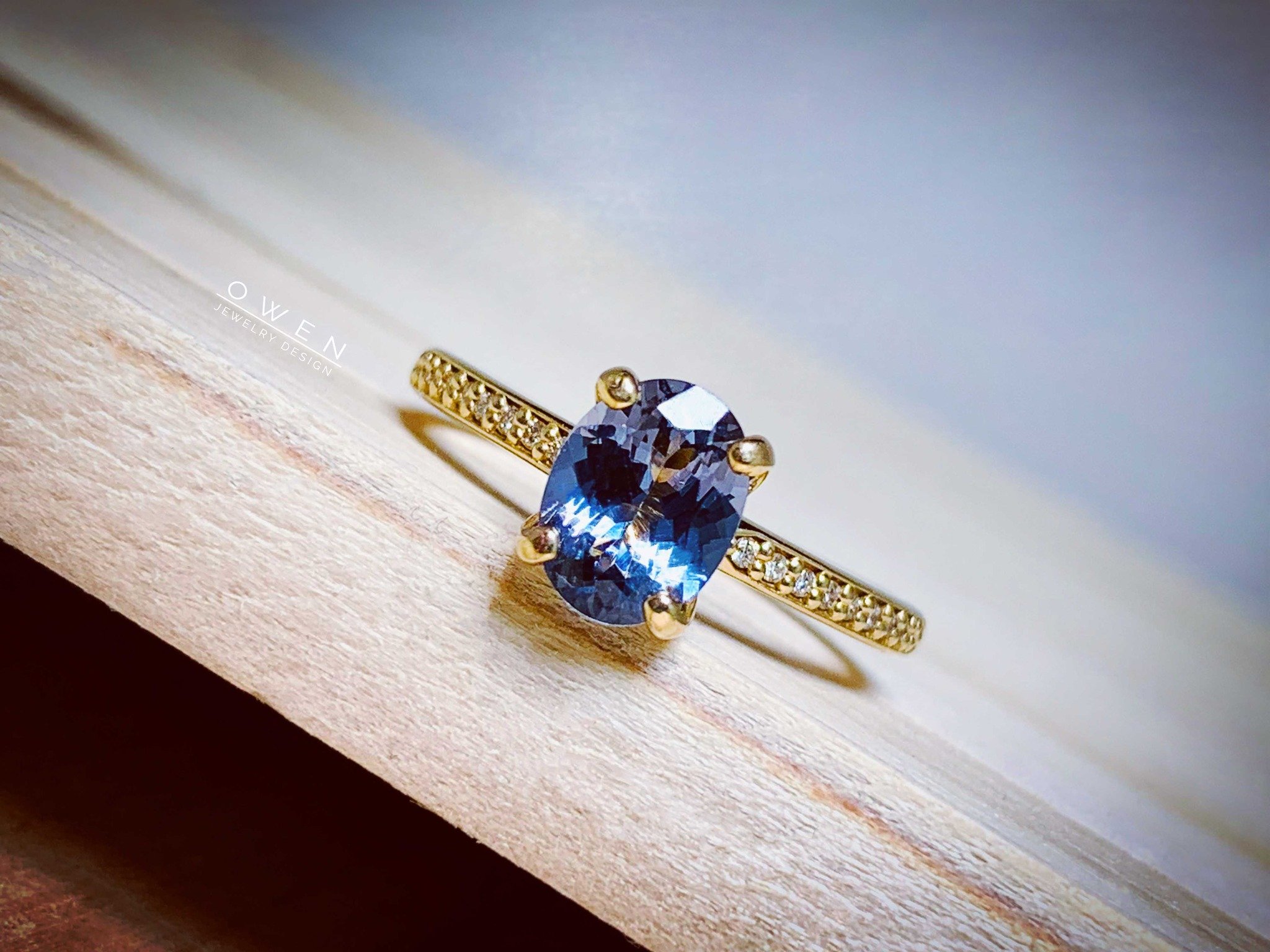 CUSTOM YELLOW GOLD WITH A GREY SPINEL AND ROUND CUT DIAMONDS.jpg