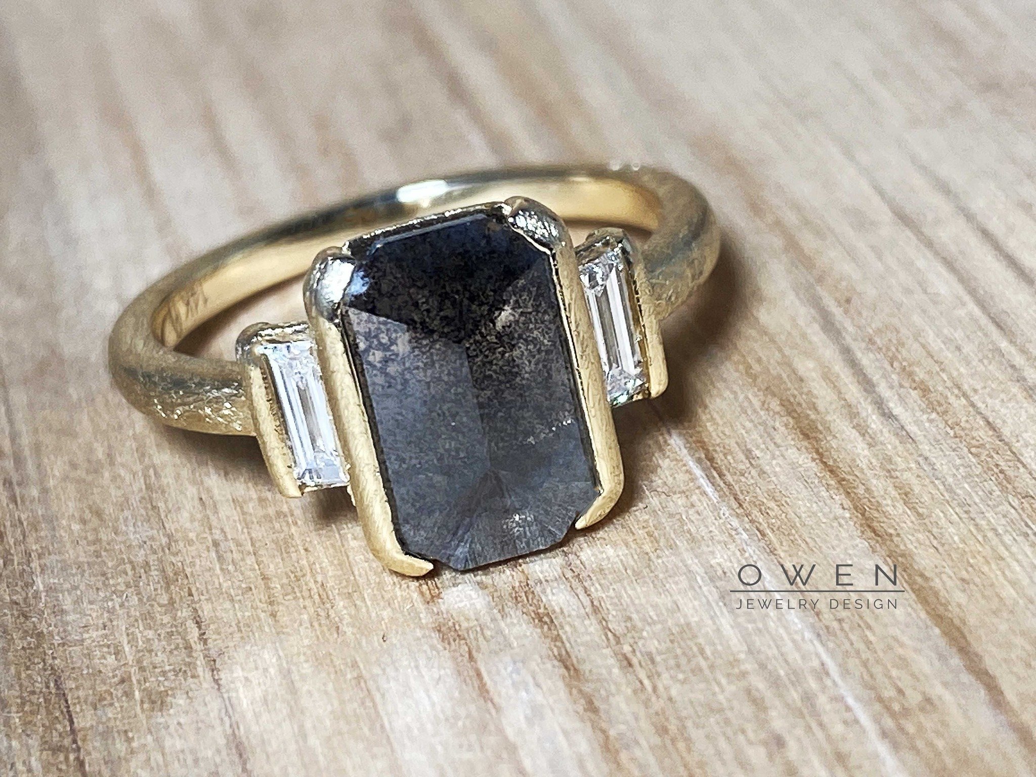CUSTOM YELLOW GOLD RING WITH A NATURAL SALT AND PEPPER DIAMOND AND STRIAGHT BAGUETTE DIAMONDS.jpg