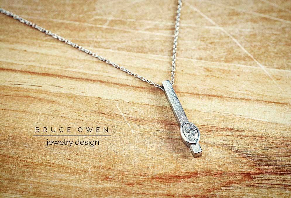 CUSTOM WHITE GOLD OVAL DIAMOND PENDANT