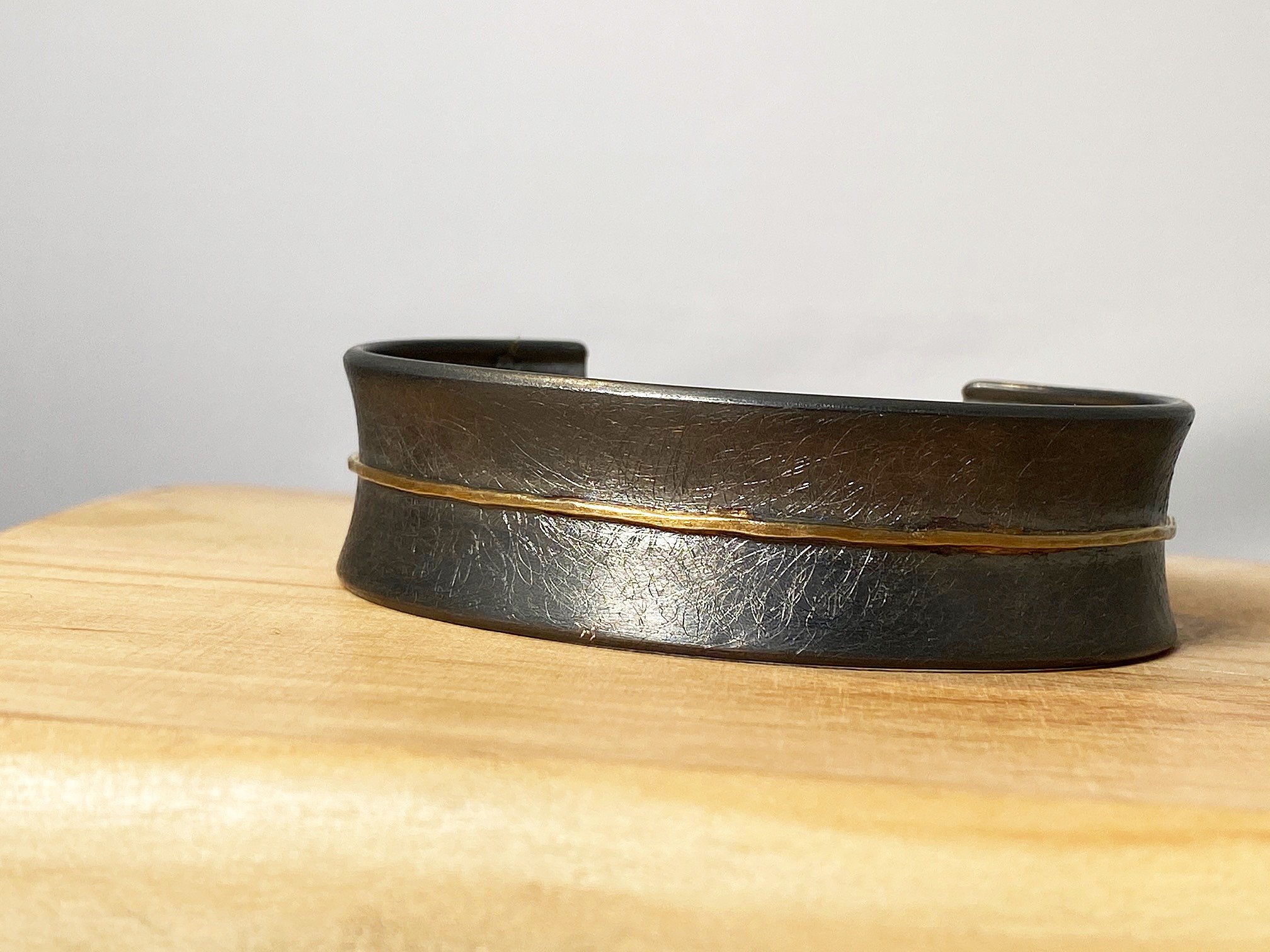 CUSTOM OXIDIZED STERLNG SILVER AND YELLOW GOLD CUFF BRACELET.jpg