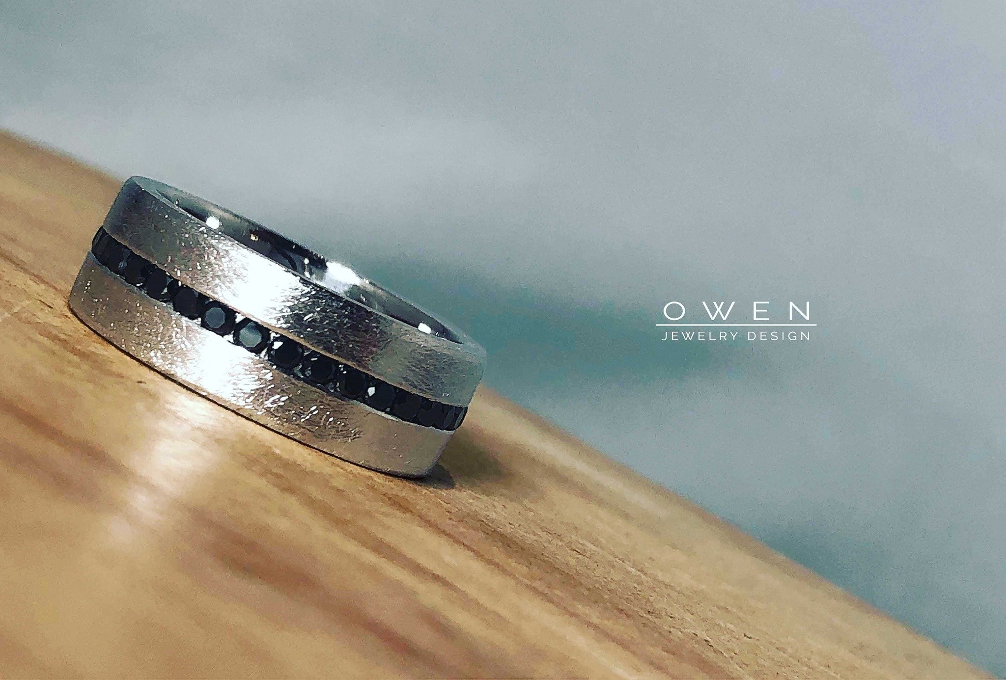CUSTOM WHITE GOLD WEDDING BAND WITH ROUND BLACK DIAMONDS.jpg