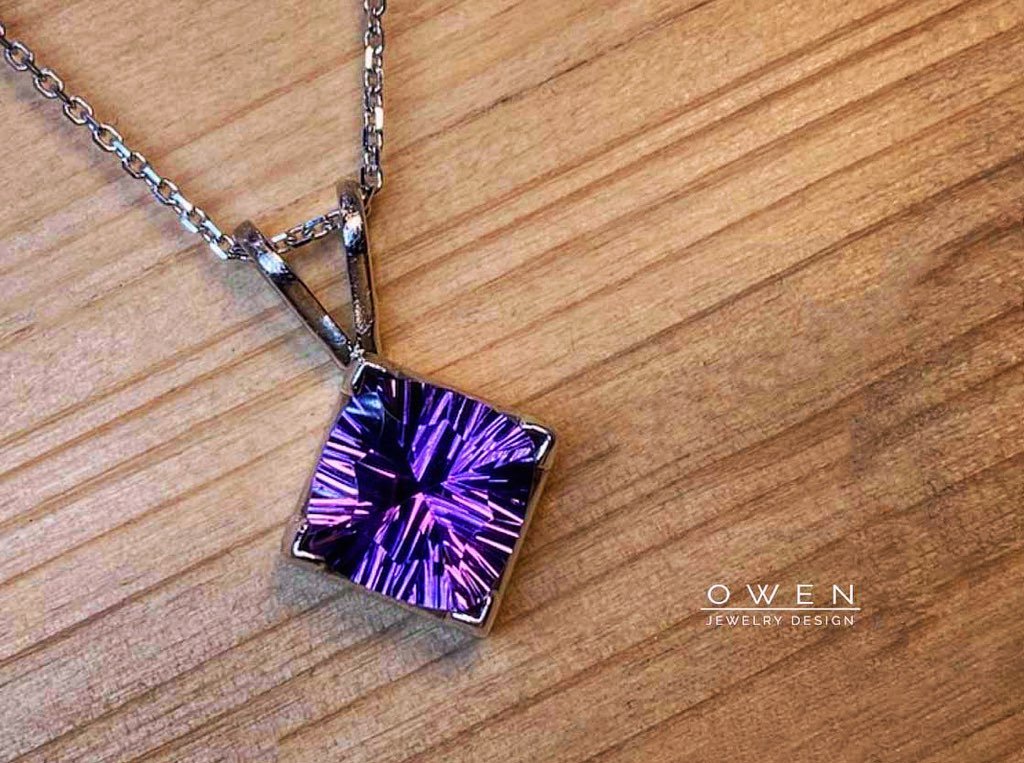 CUSTOM WHITE GOLD PENDANT WITH A FANTASY CUT AMETHYST.jpg