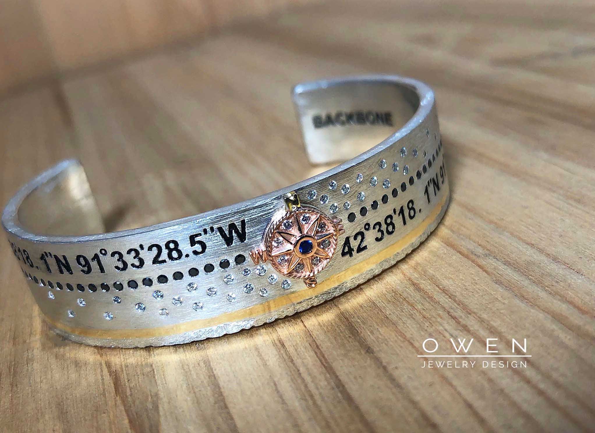 CUSTOM STERLING CUFF WITH YELLOW AND ROSE GOLD ACCENTS WHITE AND BLACK DIAMONDS AND ENGRAVING THAT TELLS A STORY.jpg