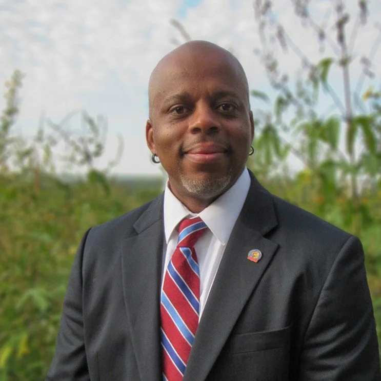 Black man wearing a gray suit