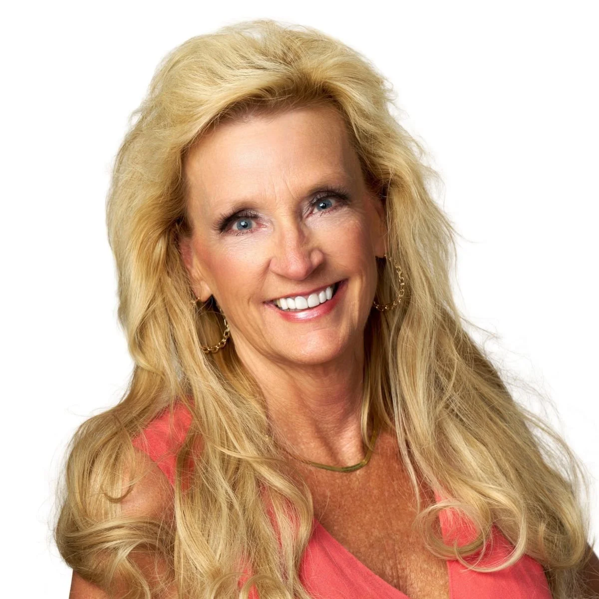 White woman with long blonde hair wearing a pink top