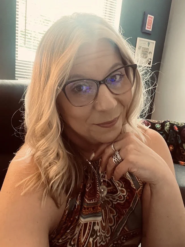 white woman wearing glasses