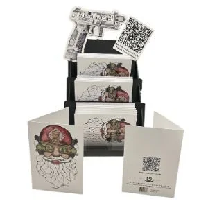 A set of trading cards with a skull and rose illustration, held in a black display box, with QR codes on some cards