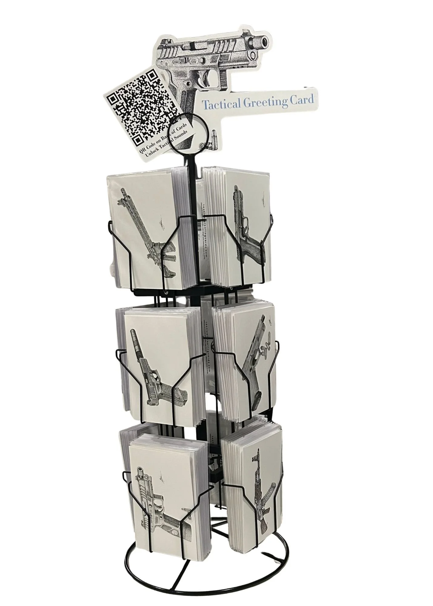 A metal rotating display stand holding tactical greeting cards with illustrations of guns and a sign that reads "Tactical Greeting Card."