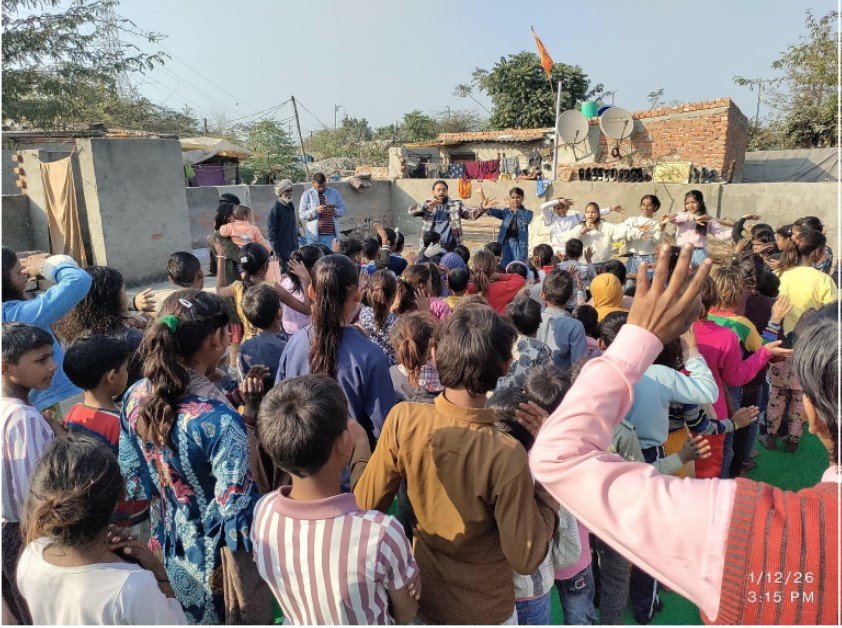 Children learning a song at the Delhi Movement Christmas party, Viva India