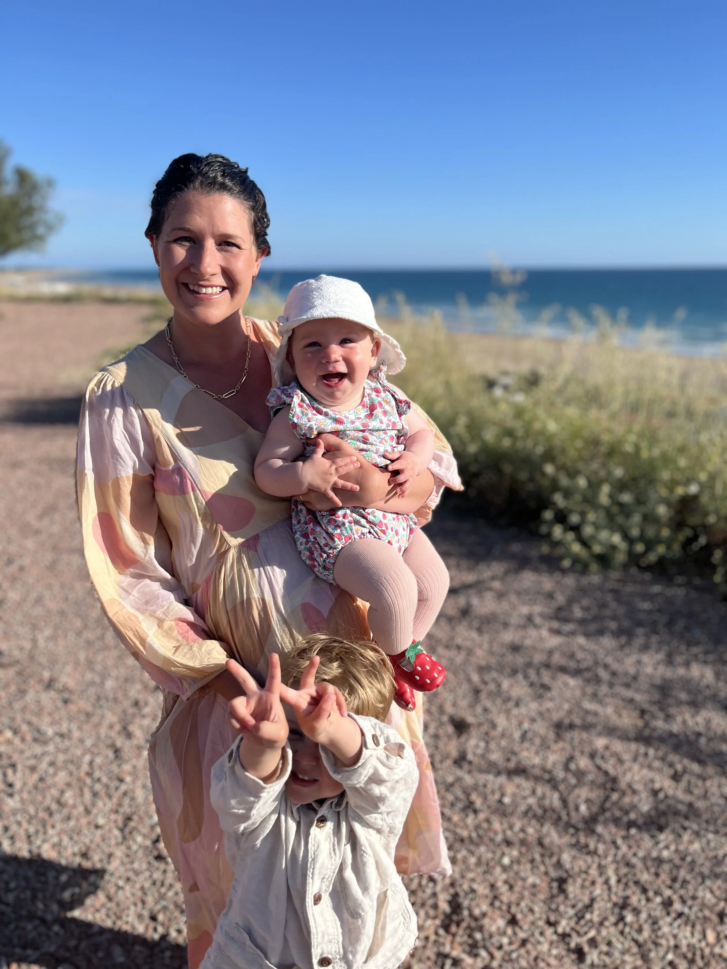 Anna and her two children on holiday 2026
