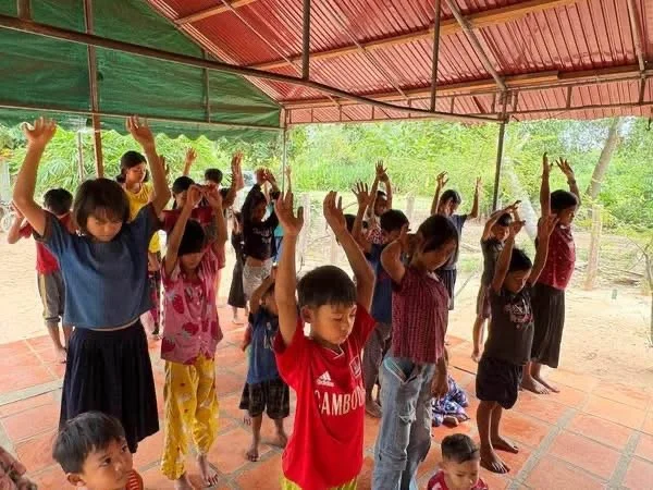 Children in a prayer event in Cambodia