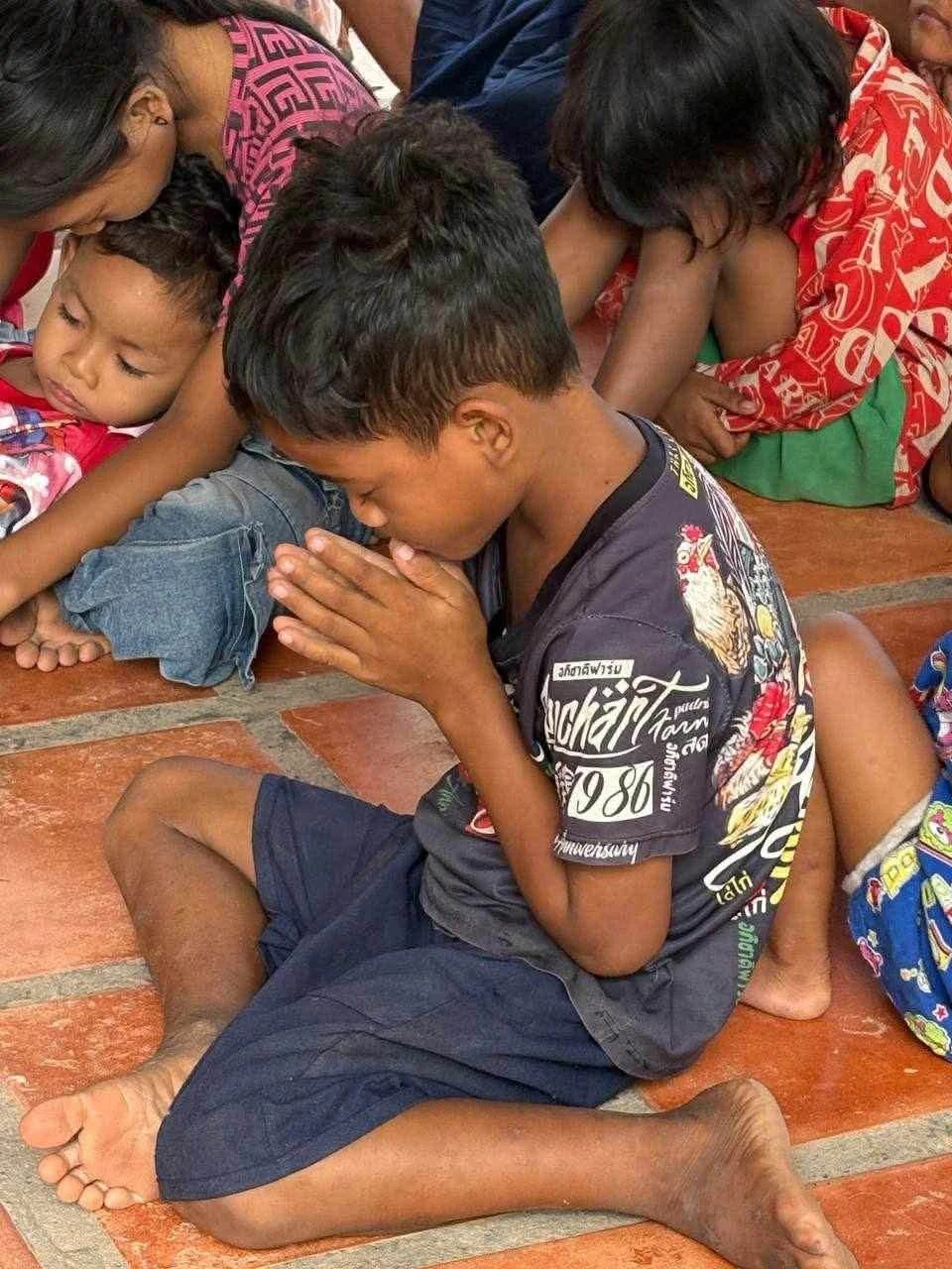 A child praying in Cambodia