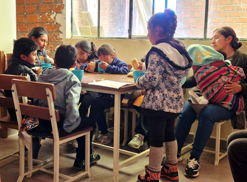 Vulnerable children at an Oruro After School Club using materials form the Viva safeguarding toolkit.